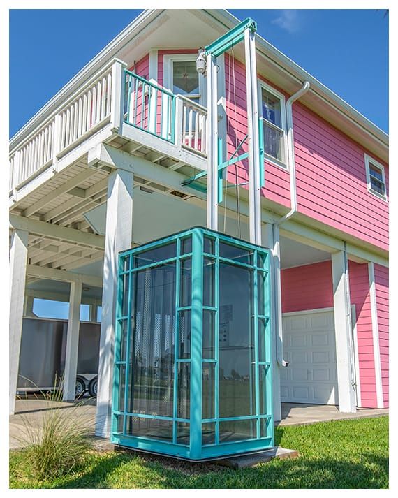 Premium balcony elevator design with custom glass finish in a luxury outdoor space