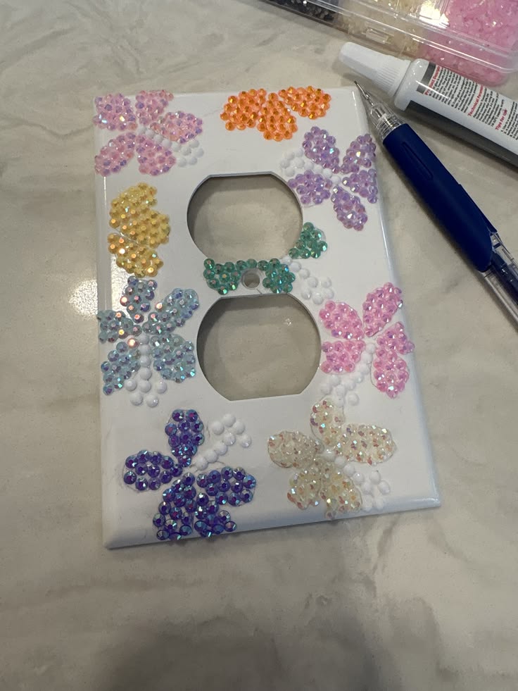 Sealing a finished bedazzled switch plate with clear spray